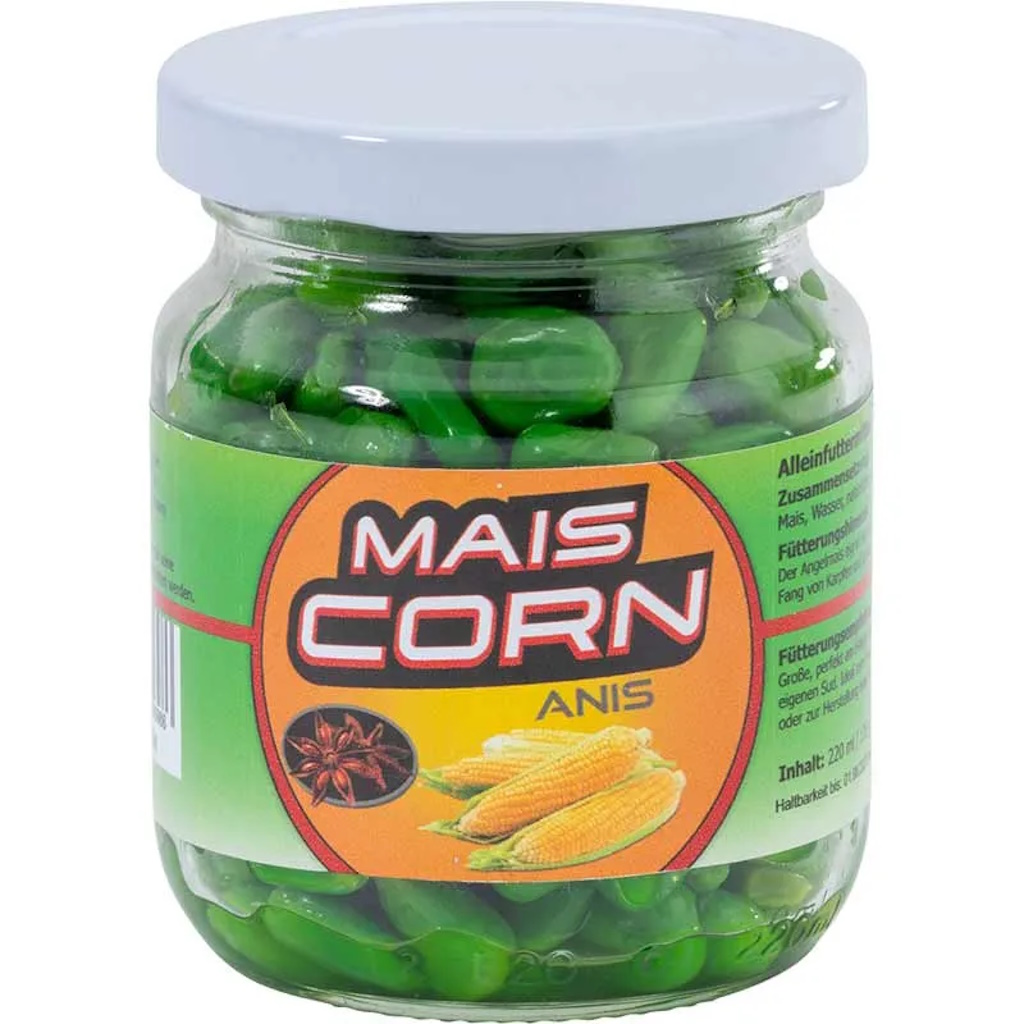 Grüne Anis-Bonbons in Glasbehälter mit weißem Deckel